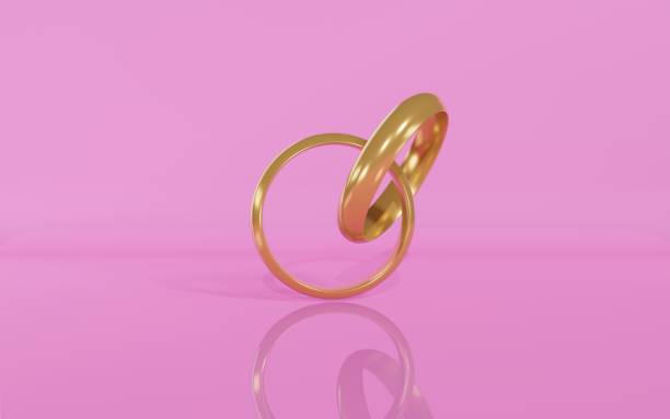 istock 3d Render of Attached Engagement Rings Against Pink Background 1292628102