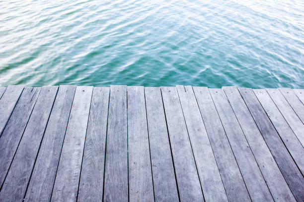 istock Close up plank wood table floor with natural pattern texture. Empty wooden board background. Backdrop 1292628194