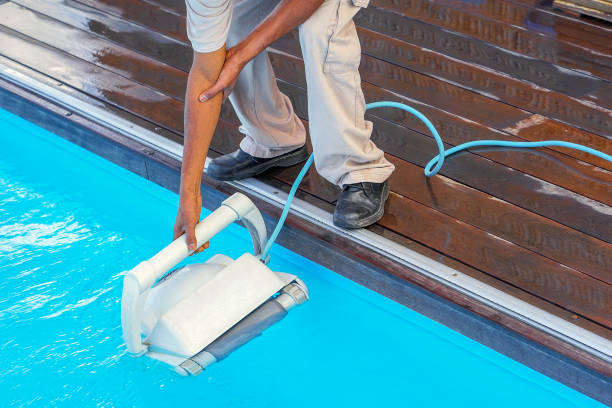 istock African Hotel staff worker cleaning the pool 1292628447