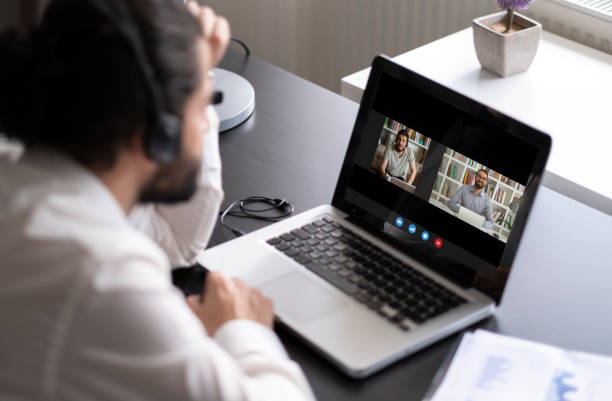 istock Laptop screen view diverse businesspeople involved at group videocall 1292631283