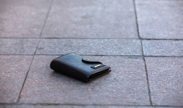 istock wallet on the street floor 1292634370