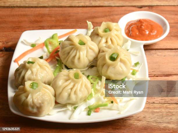 Veg Steam Momo Nepalese Traditional Dish Momo Stuffed With Vegetables And Then Cooked And Served With Sauce Over A Rustic Wooden Background Selective Focus Stock Photo - Download Image Now