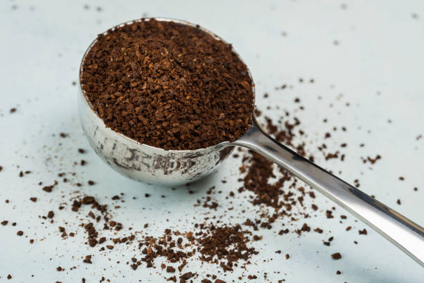 istock Ground Coffee Beans Spilled from a Coffee Scoop 1292635664