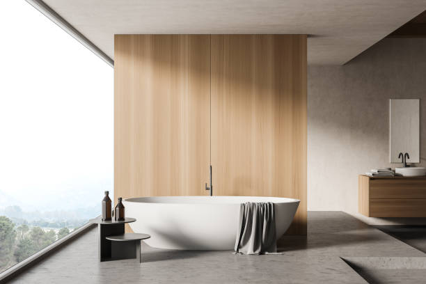 istock White and wooden bathroom interior with tub 1292635717
