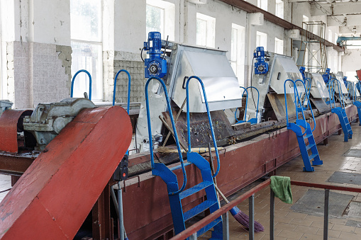 Machinery for sewage filtration from solid impurities at wastewater treatment plant.