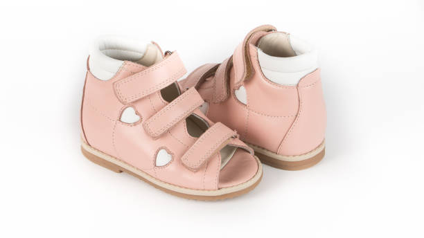 istock children's beige orthopedic sandals on a white background 1292637115