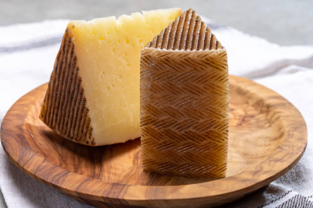 Spanish cheese manchego made from sheep milk Spanish cheese manchego made from sheep milk close up machego stock pictures, royalty-free photos & images