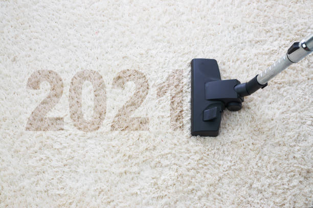 istock Home cleaning with vacuum cleaner and copy space for a text, new year 2021 1292638235