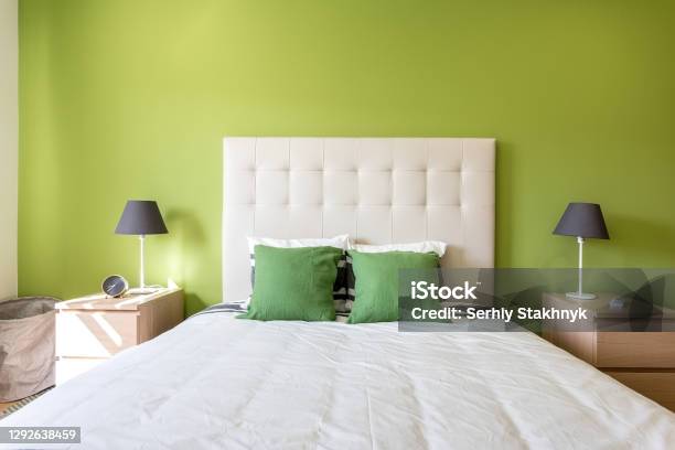 Modern Bedroom In White And Green Colors European Hotel Design And Inside Stock Photo - Download Image Now