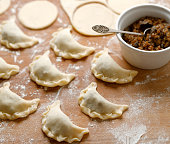 A close-up view of traditional dumplings with vegetarian filling during preparation