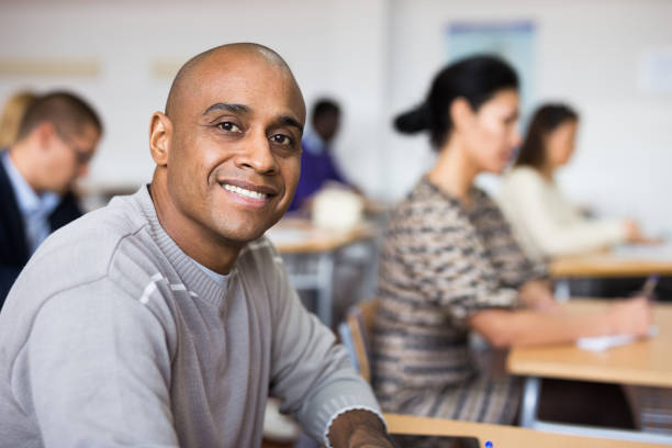istock Focused man working at adult education class 1292641427