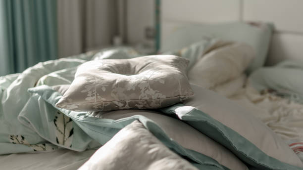istock Decorative small pillows on bed in bedroom in early morning 1292642410