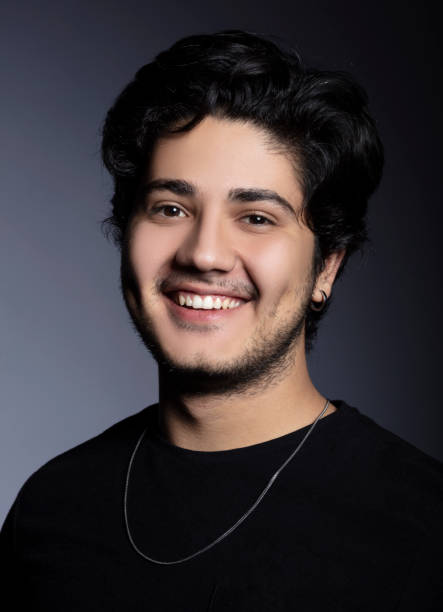 istock Portrait of handsome young man looking at camera and laughing. 1292642437
