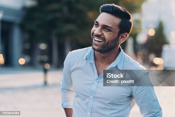 Smiling Young Man Outdoors In The City Stock Photo - Download Image Now - Men, Indian Ethnicity, Smiling