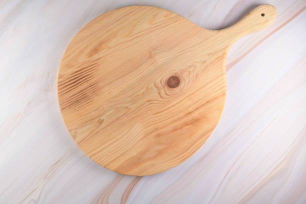 istock Wooden cutting board on a gray marble background 1292646256