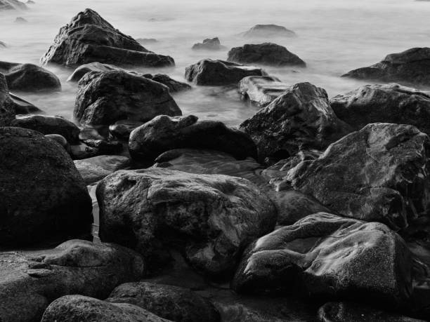 istock Peebles in shallow water. Long exposure photography 1292646904