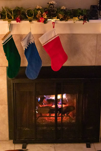 istock Christmas stockings hang from a fireplace mantel 1292647936
