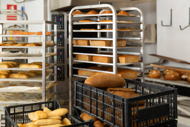 istock Fresh hot bread in crates in bakery 1292648166