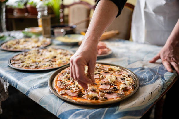 istock Mother preparing pizza stock photo 1292650051
