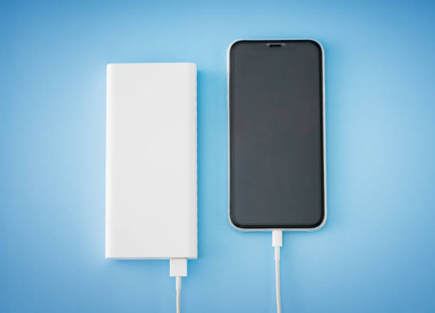 istock Charging smart phone with power bank 1292652188