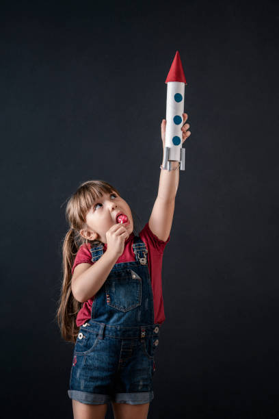 istock Young Business Girl with Rocket Pack 1292652224
