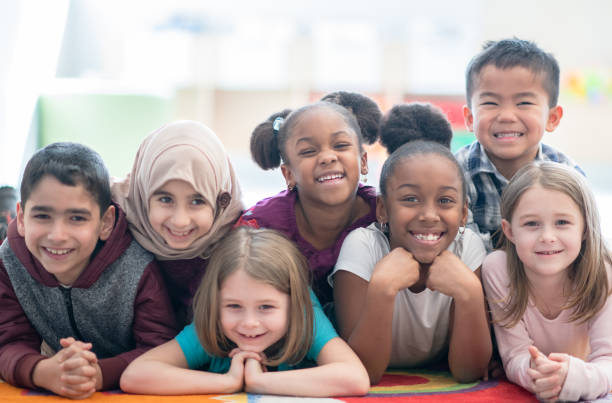 istock Multi ethnic preschool children smiling 1292652707