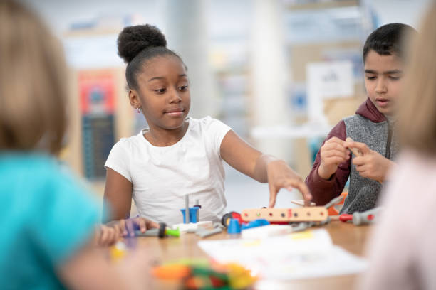 istock Children playing together at public library 1292652713