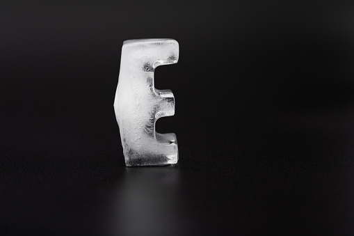 Ice letter E on black background.
