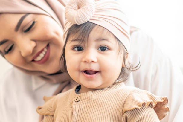 istock Beautiful Muslim mother and daughter 1292657384
