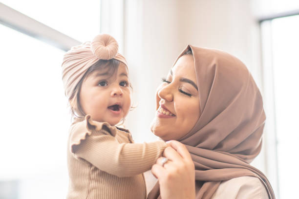 istock Beautiful Muslim mother and daughter 1292657385