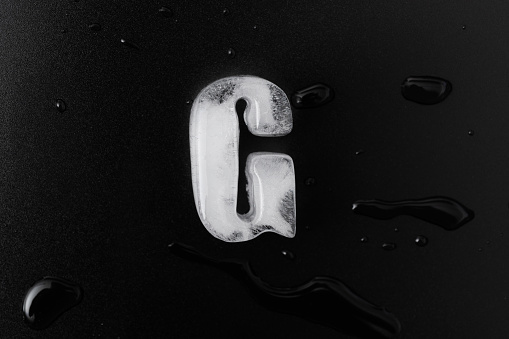 Ice letter G on black background.