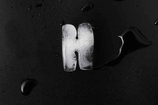 Ice letter H on black background.