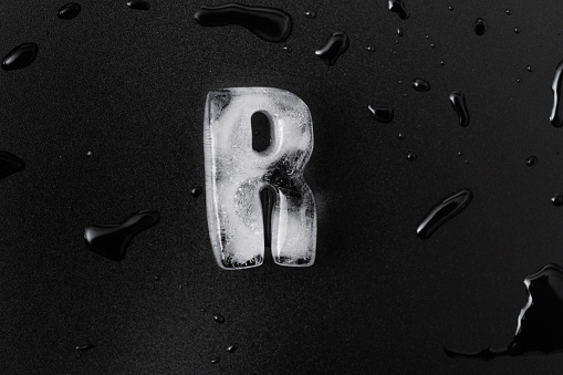 Ice letter R on black background.