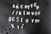 Ice alphabet on black background