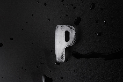 Ice letter P on black background.