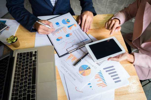 istock Business team meeting working with new startup project, discussion and analysis data the charts and graphs. Digital tablet calculator, laptop computer using, Business finances and accounting concept 1292660235