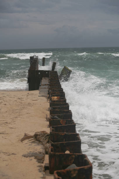 istock Seascape with an old steel breakwater 1292660844