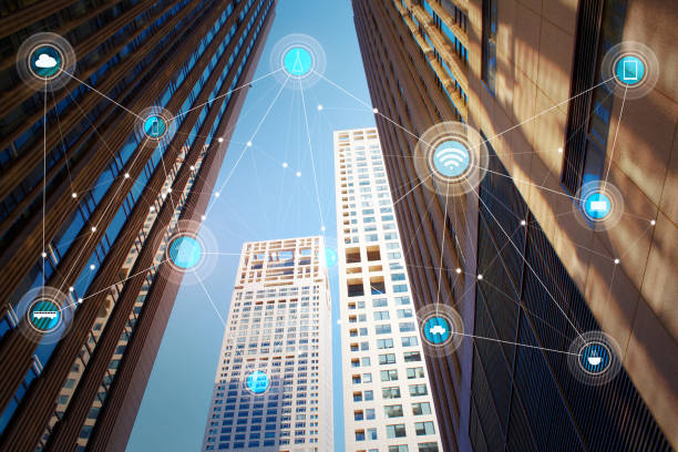 istock Looking up lower angle exterior commercial building and wireless communication network, abstract image visual, internet of things 1292660853