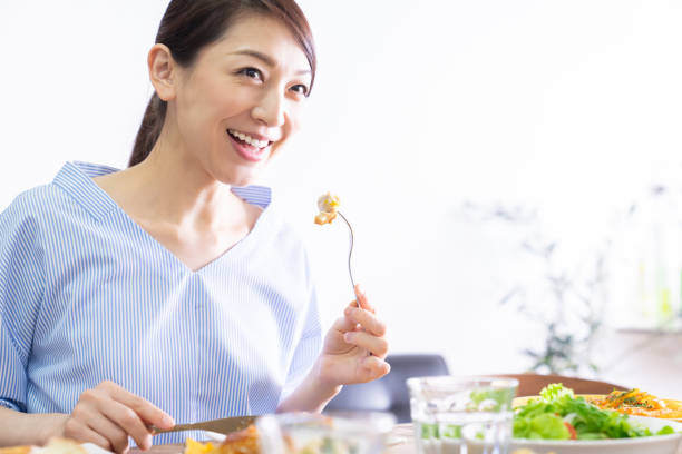 istock asian woman who eats 1292662333