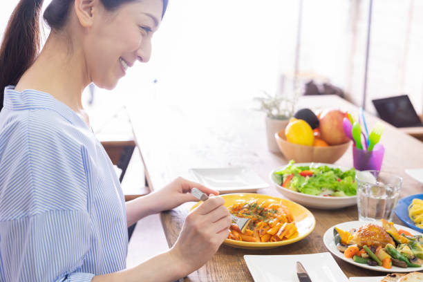 istock asian woman who eats 1292662343