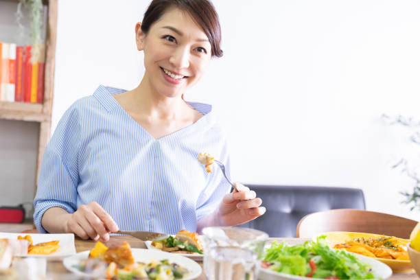 istock asian woman who eats 1292662431