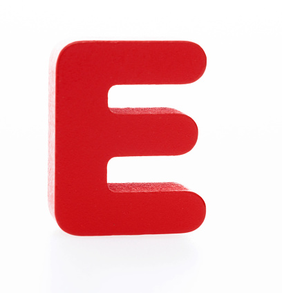 Wooden letter E on white background.