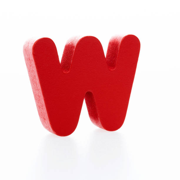 istock Wooden letter W on white background 1292663070