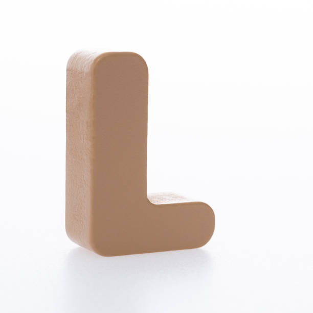 istock Wooden letter L on white background 1292664712