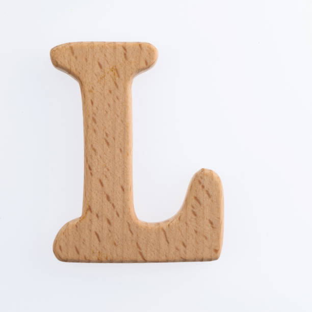 istock Wooden letter L on white background 1292667263