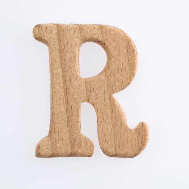 istock Wooden letter R on white background 1292667312