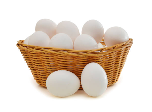 istock Many eggs in basket isolated on white 1292667317