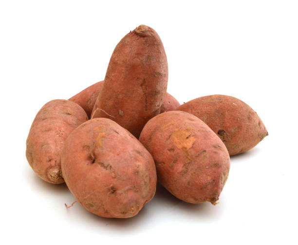 istock Sweet potatoes in a basket against a white background. 1292667955