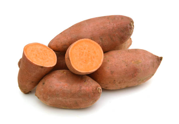istock Sweet potatoes in a basket against a white background. 1292668018
