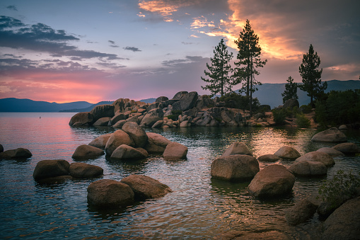 A mesmerizing sunset drapes this iconic Lake Tahoe landscape in a beautiful range of colors on this warm summer evening. This sunset remains one of my fondest memories as I gazed peacefully over the lake, watching the day give its last goodbyes.